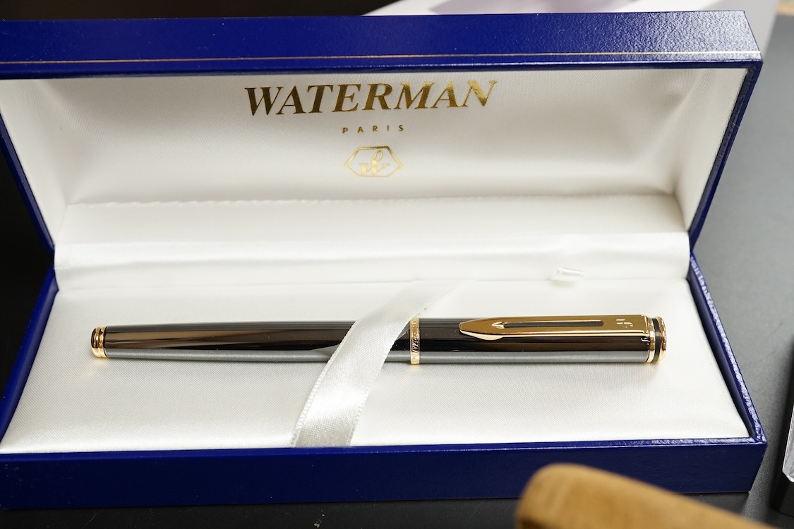 Four assorted cased Waterman pens, elven other assorted pens including Scheaffer and Parker and an engine turned silver pen.
